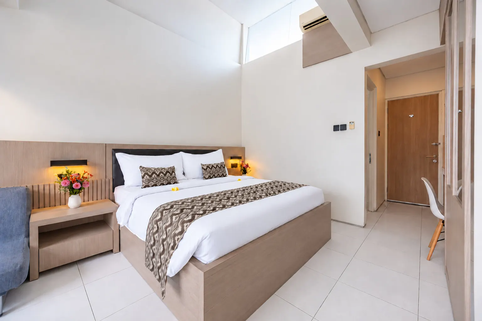 Master Suite in Denpasar, Bali, with light wood furnishings and high ceilings